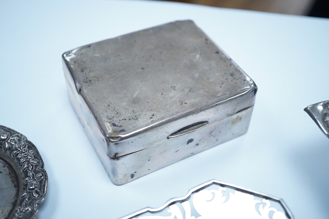 A small group of silver to include an Elizabeth II pierced shallow dish by Viners Ltd, Sheffield, 1957, diameter 12.4cm, a 1930's silver mounted cigarette box, a George III silver fiddle pattern sauce ladle and five silv